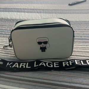 Brand new Karl Lagerfeld cross body white bag w/black strap silver hardware